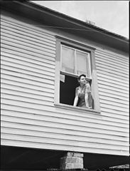 File:Mrs. Milong Bond, wife of tipple worker, looking out her kitchen ...