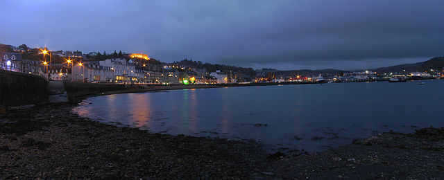 Oban and bay at night, note McCaig's Tower is illuminated.