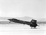 X-15 touching down on its skids, with the lower ventral fin jettisoned.