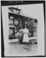 Photocopy of photograph (original in possession of Chiricahua National Monument), photographer unknown, c.1917 LILLIANA AND HILDEGARD ERICKSON IN FRONT OF RANCH HOUSE - HABS ARIZ,2-WILCO.V,1-16.tif
