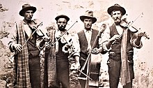 Popular Gozitan musicians known as Id-Dudi, 1910s. Photo Mikiel Farrugia Popular Gozitan musicians known as Id-Dudi, 1910s. Photo Mikiel Farrugia.jpg
