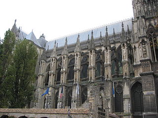 Buttresses on the north side of the nave support the upper walls