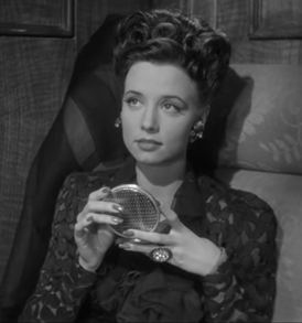 Renee Godfrey in Terror by Night (1946).png