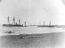 Wrecked ships in Apia Harbor, Upolu, Samoa, soon after the storm. The view looks about northward, with Trenton and the sunken Vandalia at left, the German corvette Olga beached in the center distance and Nipsic beached in the right center. Trenton's starboard quarter gallery has been largely ripped away. Samoan Crisis wrecks.jpg