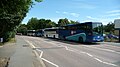 English: A line up of various Southern Vectis and Wightbus vehicles, in Wellington Road, Carisbrooke, Isle of Wight. Due to the sparsely spread population of the island, most school children have to travel quite a long way to school. There are three schools in Carisbrooke, and so a lot of buses turn up every school day to pick up and drop everyone off. Around 15 school services are scheduled to go to the school.