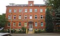 Administration building in open development and rear building