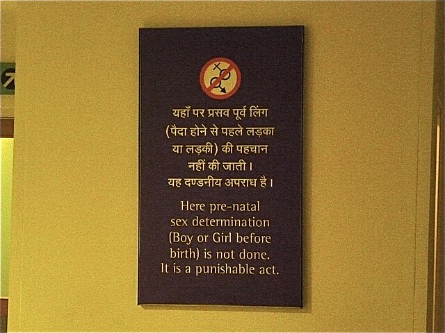 A sign in an Indian hospital stating that prenatal sex determination is a crime.