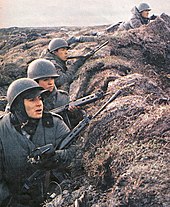 Argentine Army conscripts wearing M1 helmets in the trenches during the Falklands War Soldadosargentinos3.jpg