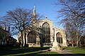 From the east, tall seven-light chancel window flanked by two five-light aisle windows, all three from 1498