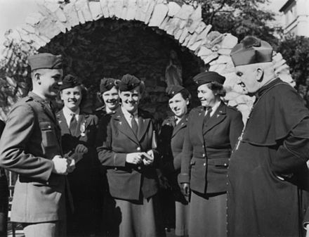 Archbishop James Duhig meeting with United States Army nurses ca. 1944 at St Stephen's Cathedral.
