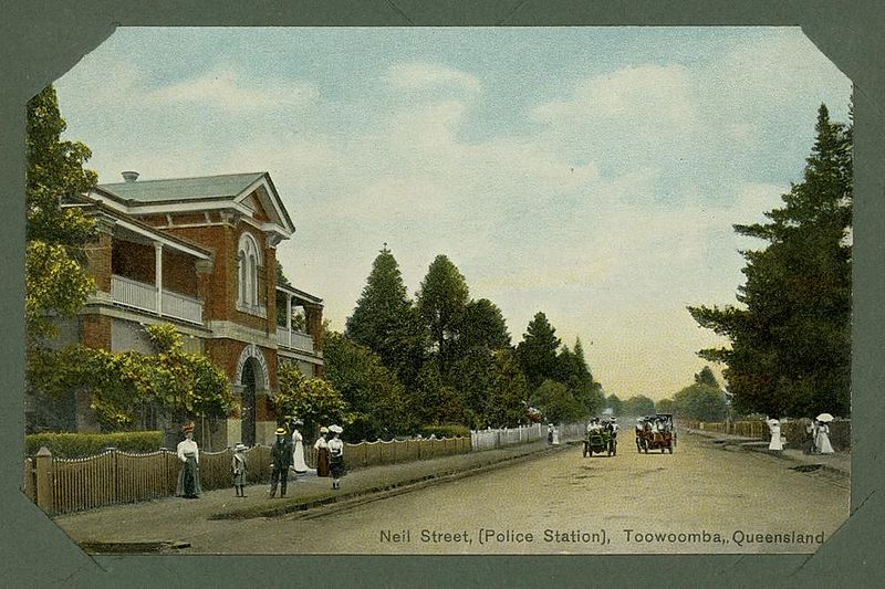 File:StateLibQld 1 241081 Two cars passing on Neil Street, Toowoomba in front of the police station.jpg