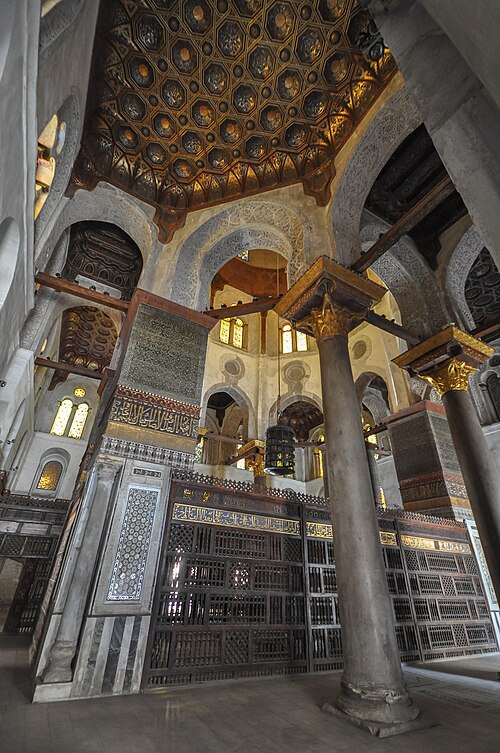 Carved stucco, marble mosaic, and gilded wooden coffers in the Qalawun complex's interior.