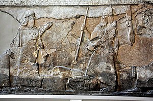 Relief from Nimrud depicting Tiglath-Pileser (right) trampling a defeated enemy Tiglath-pileser III and submission of an enemy, 8th century BC, from Nimrud, Iraq. The British Museum.jpg