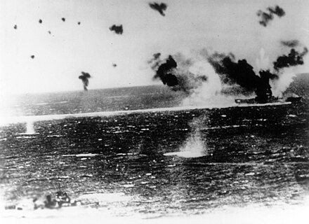Lexington (center right), afire and under heavy attack, in a photograph taken from a Japanese aircraft.