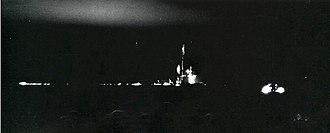 Lunga Point burning from the third kamikaze, on 21 February 1945, which sparked a brief gasoline fire. The damage from the kamikaze attacks proved to be minimal. USS Lunga Point (CVE-94) burns off Iwo Jima, 21 February 1945.jpg