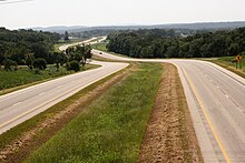 US 62/US 412 serves Mountain Home between two winding, rural segments through the Ozark Mountains US 62 and US 412 in Mountain Home.jpg