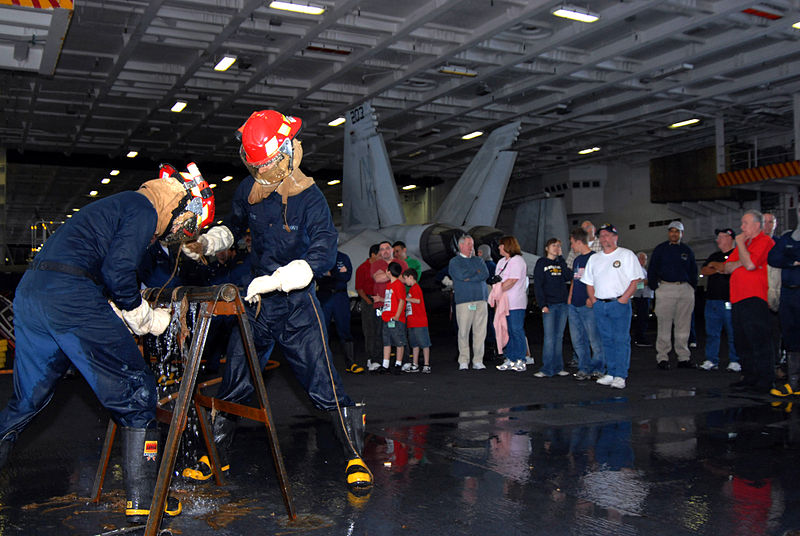 File:US Navy 070417-N-3659B-165 Members of a repair locker demonstrate pipe-patching techniques to a group of Tigers during tiger general quarters in the hangar bay of USS Ronald Reagan (CVN 76).jpg