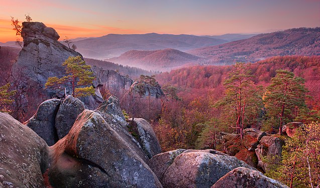 The Dovbush rocks seen at twilight, located in the Polyanytskiy Regional Landscape Park, Ukraine. Photo by Пивовар Павло.