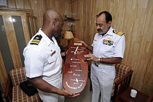 Indian Navy Vice Admiral D. K. Joshi (right) as the Commander-in-Chief of the Andaman and Nicobar Command 100323-N-OX597-187 Indian navy Vice Adm. D. K. Joshi, right presents a wooden plaque.jpg