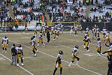 Players warming up before Week 16 at Green Bay 2013 Pittsburgh Steelers in warmups.jpg