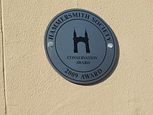 The Hammersmith Society Conservation Award Plaque on the front building of 22 St Peter's Square 22 St Peter's Square Plaque.jpg
