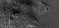 Close view of exhumed crater, as seen by HiRISE under HiWish program This crater is and was under a set of dipping layers.
