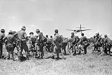 5 RAR soldiers waiting to be picked up by a RAAF de Havilland Canada DHC-4 Caribou at the conclusion of a month-long operation in October 1969 5RAR soldiers wait to be picked up by a RAAF Caribou in South Vietnam during October 1969.jpg