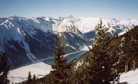 Partially frozen Achen lake in winter