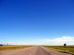 Alberta Highway 2 is a lightly travelled, four lane divided highway through farmlands near Claresholm, Alberta.