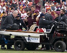 Smith following his leg fracture Alex Smith (45945178521).jpg