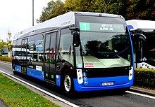 Electric bus equipped with an Alstom SRS receiver which charges the bus battery when it drives or parks over a conductive segment. Alstom APTIS-III.jpg