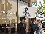 "Protesters" outside the convention, wearing Afro wigs in reference to raids on Habbo Hotel