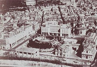 Aerial view of the square in 1937, during construction works. The Mausoleum of Augustus is surrounded by the three INPS buildings, the Museum of the Ara Pacis and two churches: San Rocco at the Augusteum (on the left) and San Girolamo dei Croati (on the right). The bigger church at the top right is Sant'Ambrogio e Carlo al Corso. Augusto1937.jpg