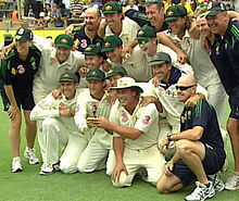 The Australian cricket team with a replica of The Ashes urn