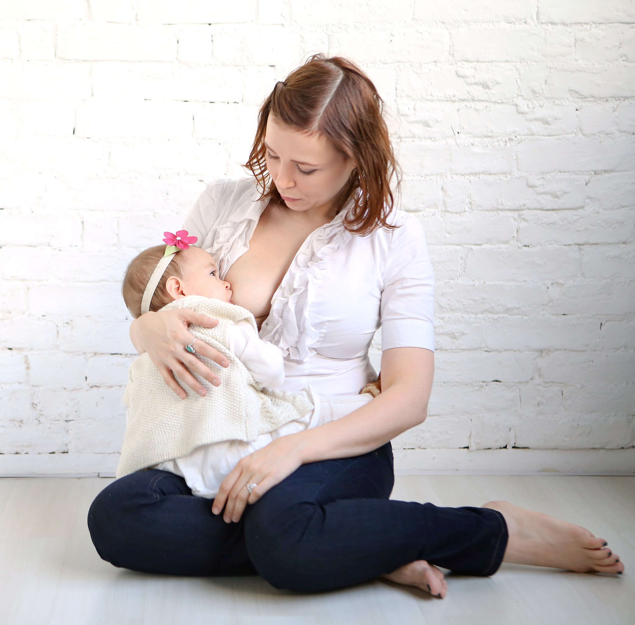 Nudist female breastfeeding