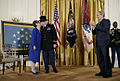 Bruce Crandall kissing his wife shortly after being presented with the Medal of Honor