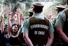 Protester in Chile with damaged eye, November 2, 2019. Carabineros frente a manifestacion feminista.jpg