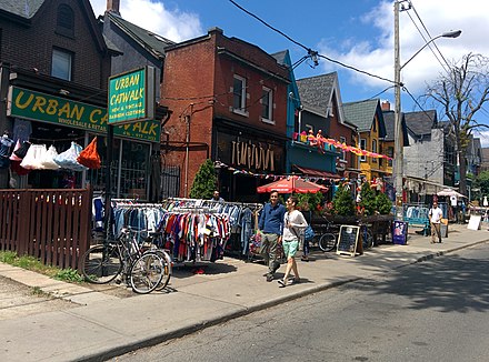 If the weather is nice, houses that have been converted into shops use their front yards to show off an assortment of vintage clothing and other goods.