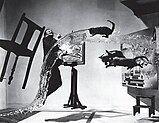 Salvador Dalí jumping while three cats fly through the air Dalí Atomicus (1948)
