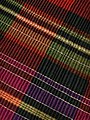 "Detail_of_Serbian_folk_costume_-_multicoloured_pleated,_wool_hand-woven_skirt.jpg" by User:BrankaVV