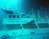 Divers inspect the wreckage of Ehime Maru, November 5, 2001