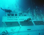 Divers inspect the wreckage of Ehime Maru off Oahu, November 5, 2001.