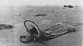 Empty surf sack, Pacific Ocean beach, probably between 1910 and 1920 (INDOCC 1950).jpg