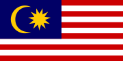Flag with 11 alternating red and white stripes along the fly and a blue canton (occupying 7 stripes) bearing a crescent and an 11-point star.