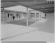 Students congregated at the main entrance to Harry B. Thompson Middle School in 1962. Harry Thompson Junior High School, Syosset, Long Island. LOC gsc.5a28637.tif