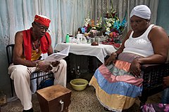 Santería is a system of beliefs that merge the Yoruba religion with Roman Catholic and Native Indian traditions. This ceremony is called "Cajon de Muertos". Havana (La Habana), Cuba