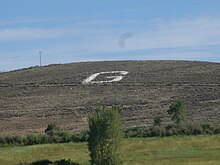 Hillside monogram on Signal Hill in Gunnison, Colorado, as seen from U.S. Hwy 50 entering the town Hillside monogram G on Signal Hill in Gunnison, Colorado.JPG