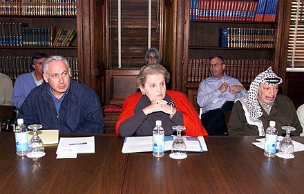 Albright with Benjamin Netanyahu (left) and Yasser Arafat at the Wye River Memorandum, 1998
