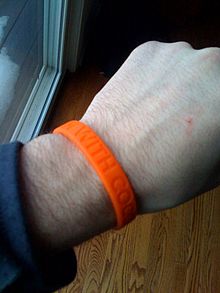 Livestrong wristbands popularized gel bracelets for charity purposes. This humorous example refers to the 2010 Tonight Show conflict. I'm with Coco wristband.jpg