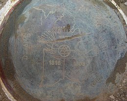 The brass disc that marks Michigan's border with Indiana and Ohio.